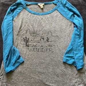 Grey and blue mid sleeve desert shirt.